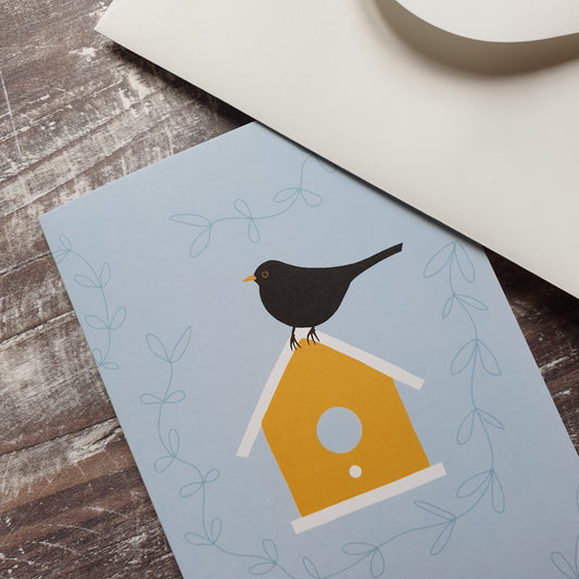 Blackbird on a Birdbox Greeting Card