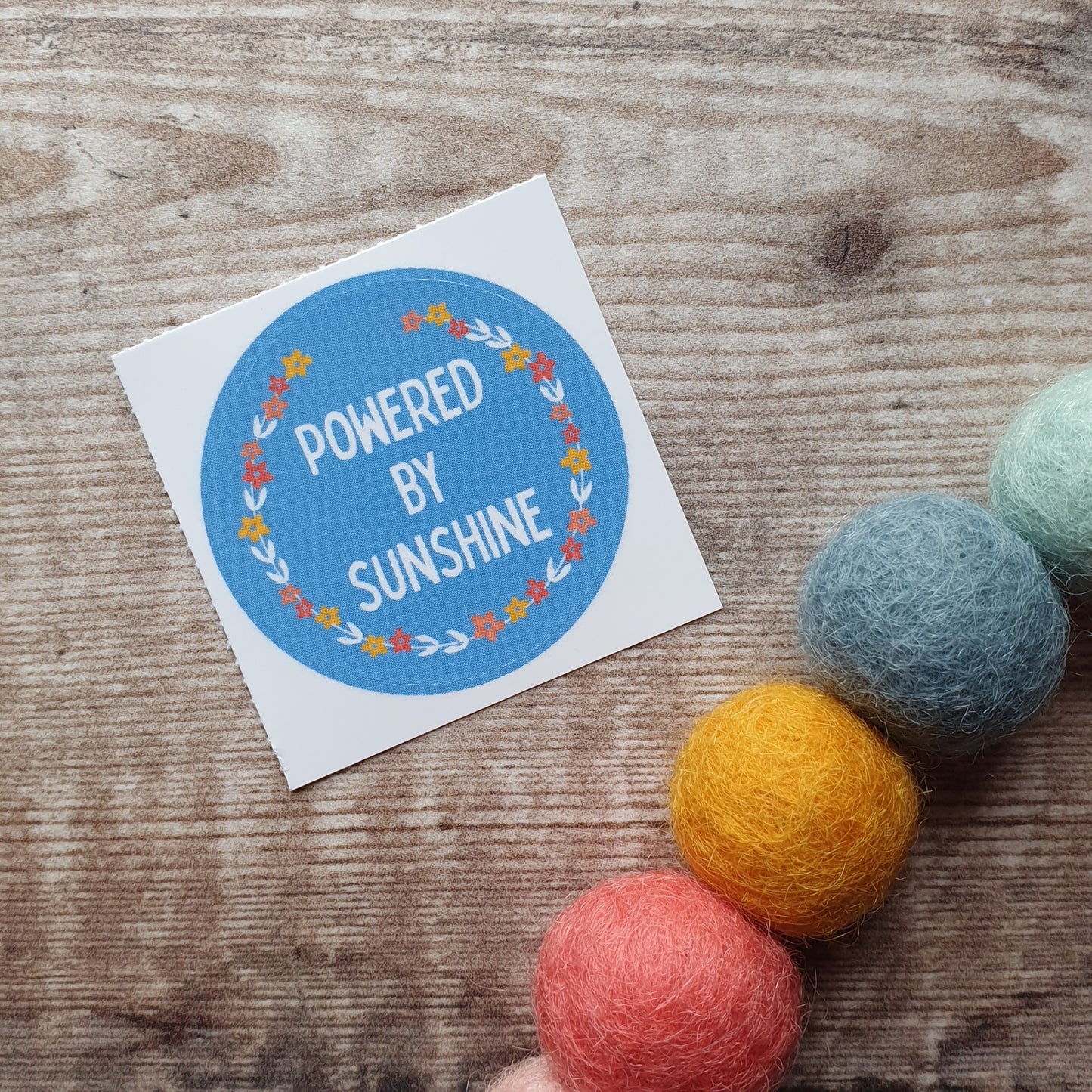Powered by Sunshine Floral Wreath 38mm Vinyl Sticker