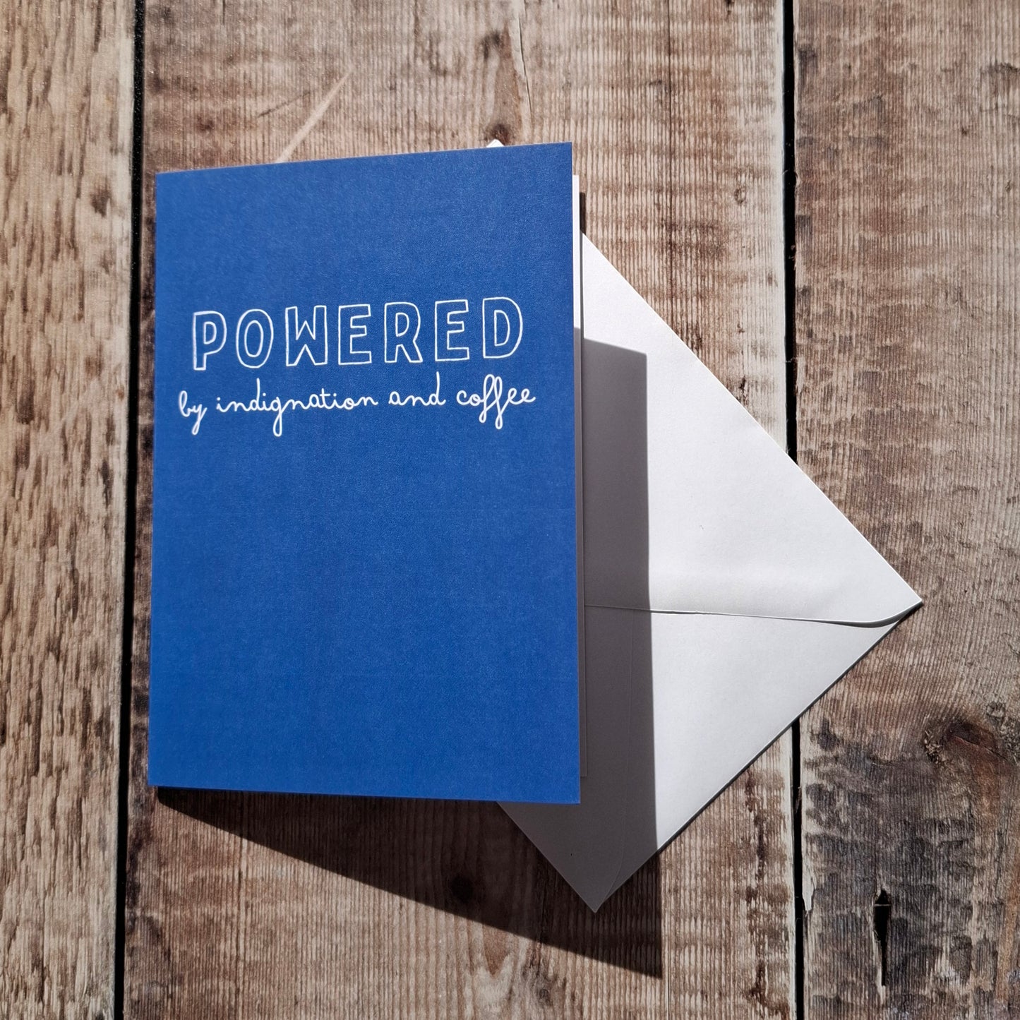 Powered by Indignation and Coffee Greeting Card