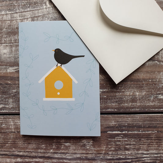 Blackbird on a Birdbox Greeting Card