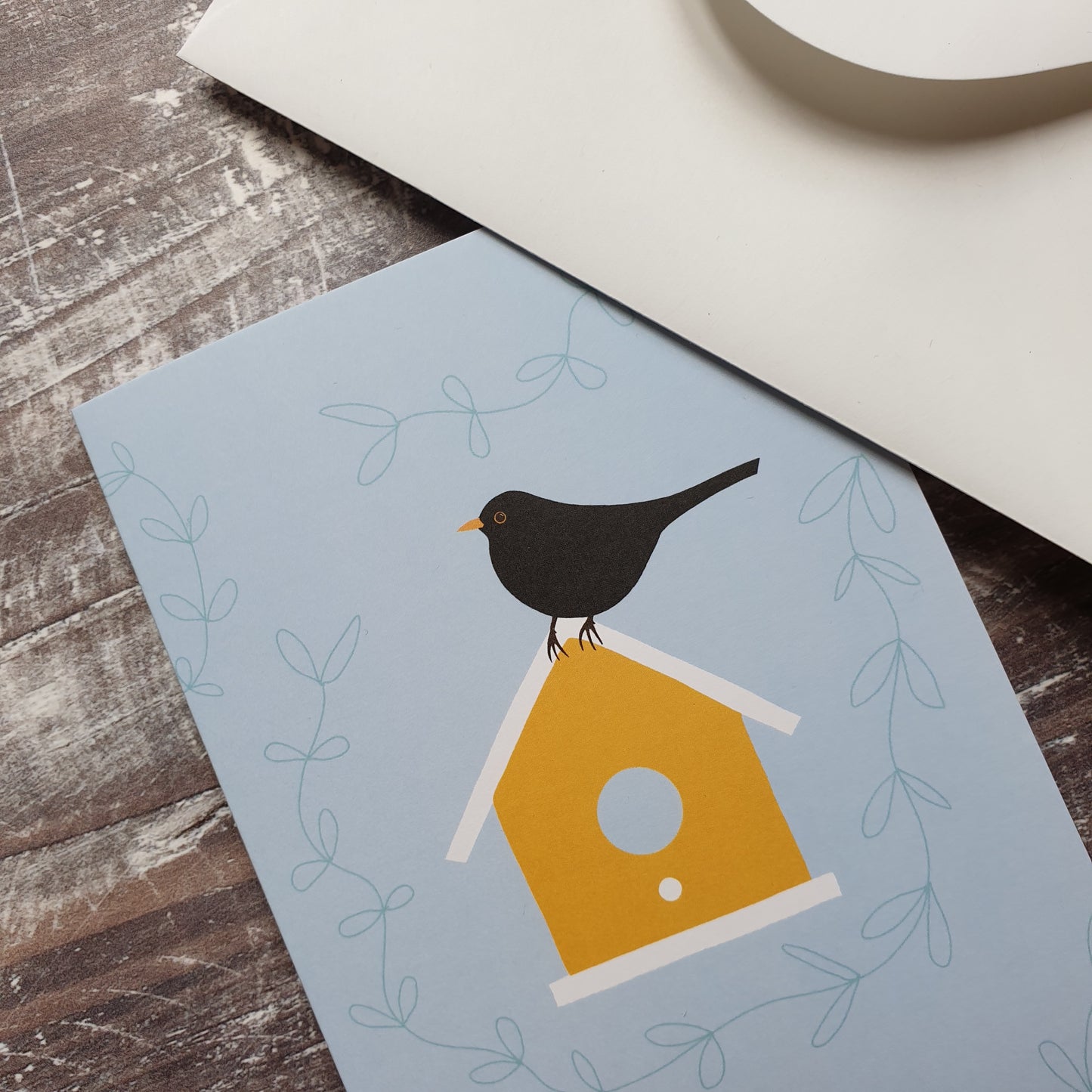 Blackbird on a Birdbox Greeting Card