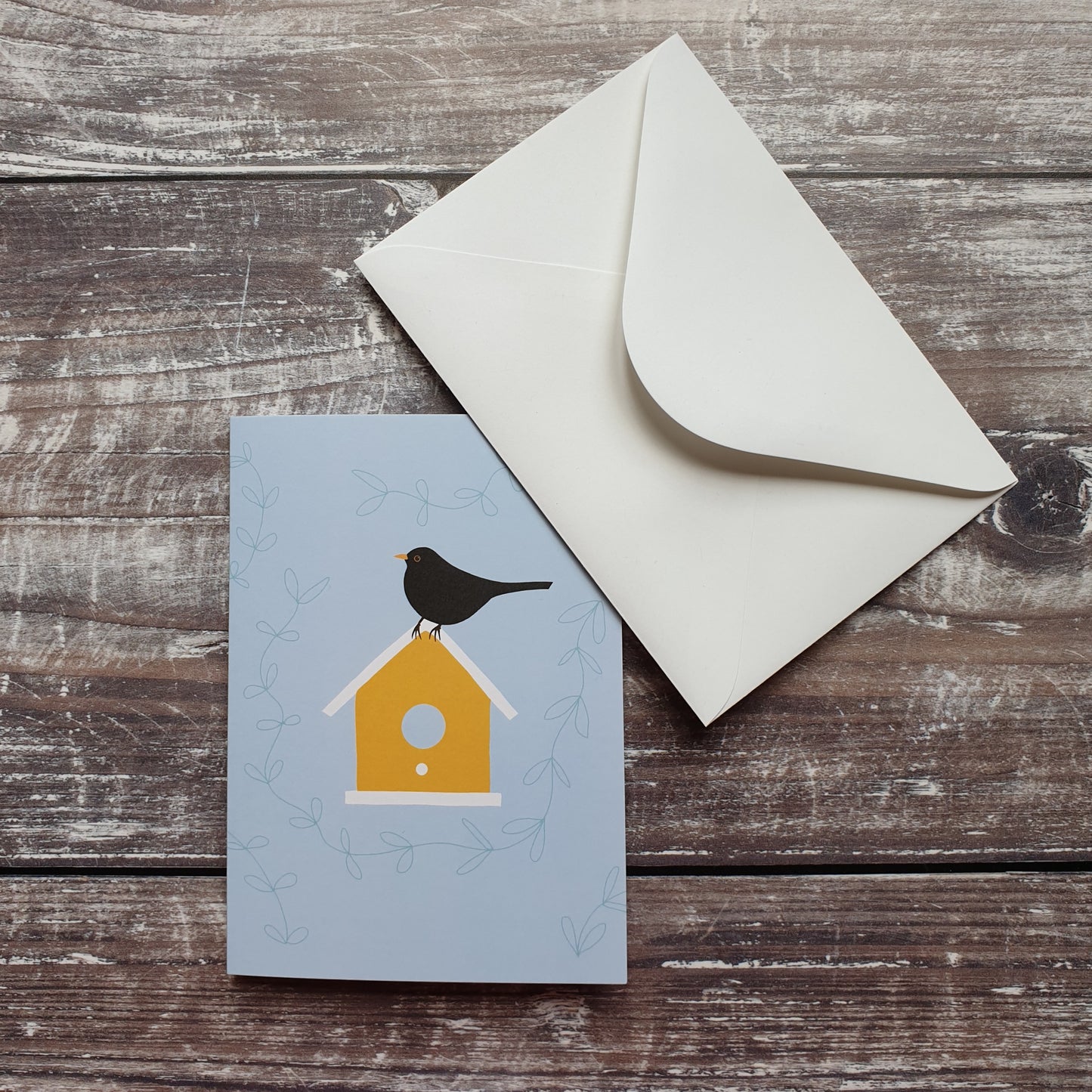 Blackbird on a Birdbox Greeting Card