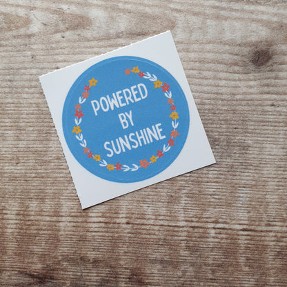 Powered by Sunshine Floral Wreath 38mm Vinyl Sticker